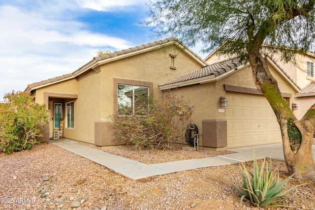 view of side of home with a garage