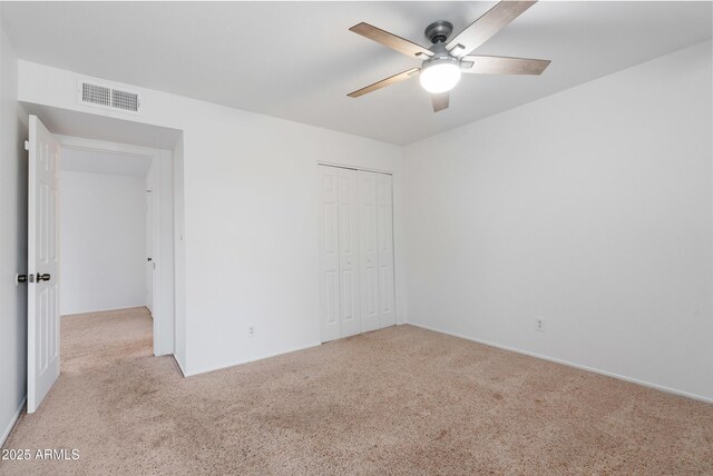 17808 N 45th Ave, Glendale, AZ 85308 - unfurnished bedroom featuring light carpet, a closet, and a ceiling fan