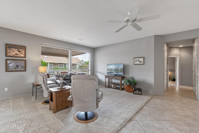 tiled home office featuring baseboards, visible vents, and a ceiling fan