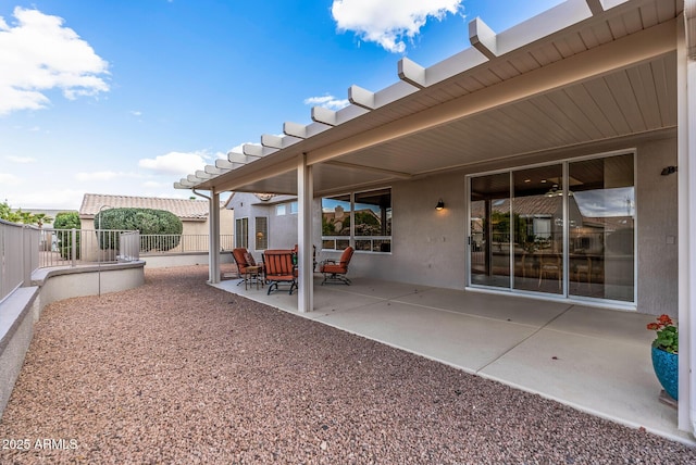 view of patio featuring fence