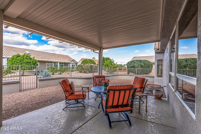 view of patio with fence and outdoor dining space