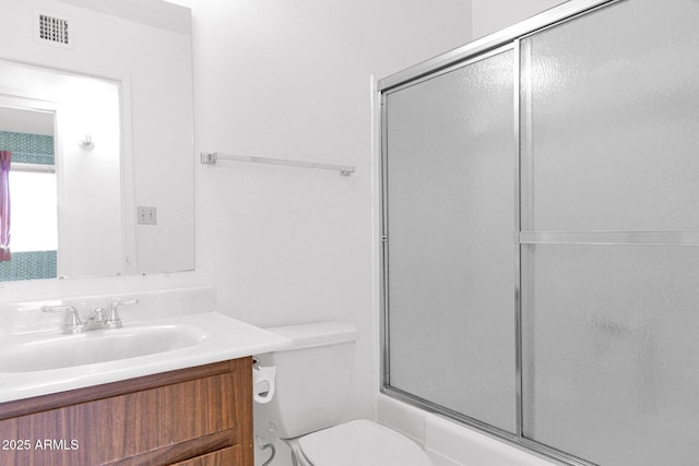 full bathroom with visible vents, toilet, and vanity