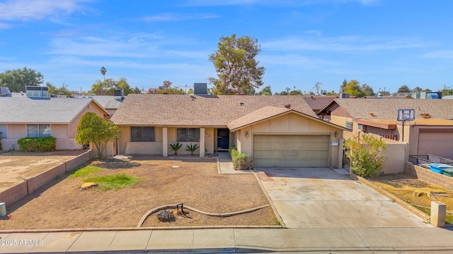 ranch-style house with a garage, stucco siding, driveway, and fence