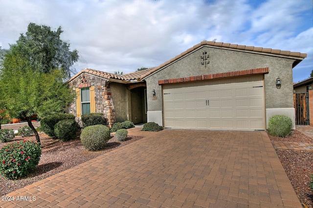 view of front of property with a garage