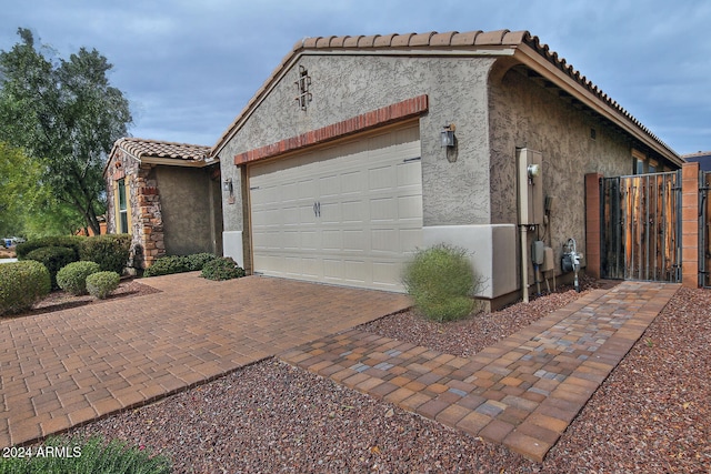 view of property exterior with a garage