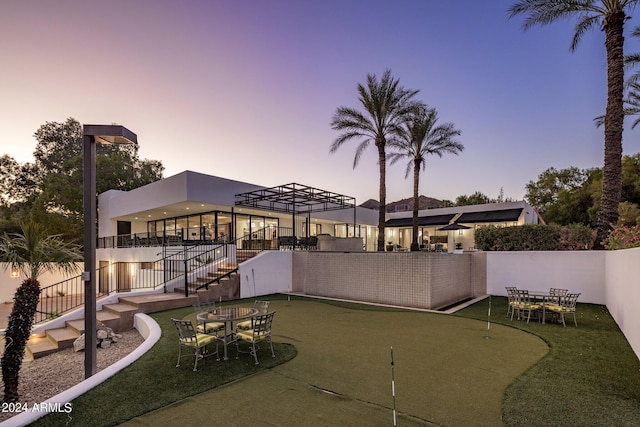 view of patio terrace at dusk