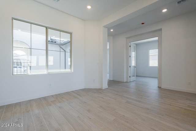 spare room with light hardwood / wood-style flooring