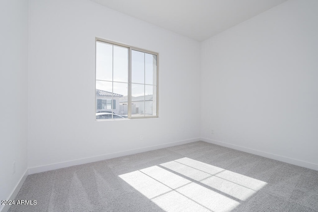 empty room featuring light carpet