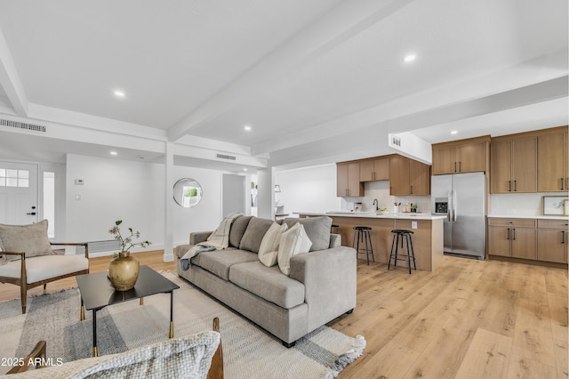 6233 E Pinchot Ave, Scottsdale, AZ 85251 - living room with beamed ceiling, light wood finished floors, and recessed lighting