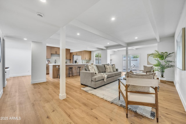 6233 E Pinchot Ave, Scottsdale, AZ 85251 - living room with beamed ceiling, recessed lighting, and light wood-style flooring