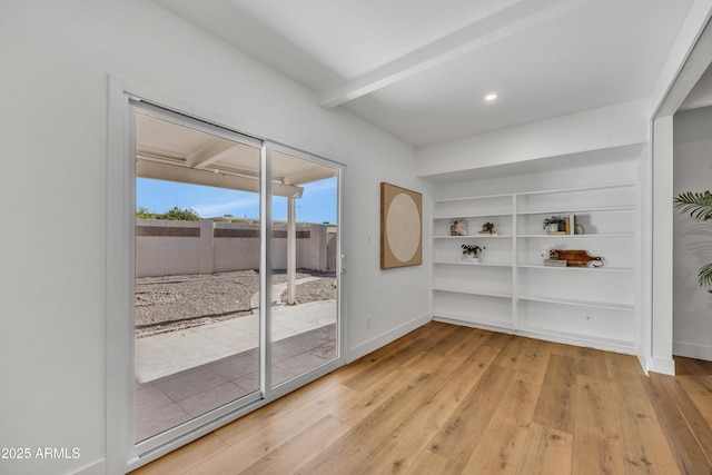 6233 E Pinchot Ave, Scottsdale, AZ 85251 - empty room with wood finished floors, built in features, beam ceiling, and recessed lighting