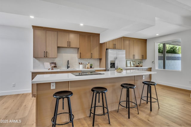 6233 E Pinchot Ave, Scottsdale, AZ 85251 - kitchen with stainless steel fridge, light countertops, decorative backsplash, and recessed lighting