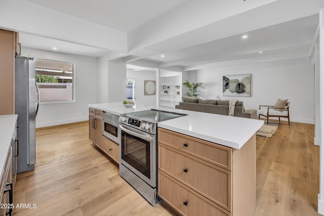 6233 E Pinchot Ave, Scottsdale, AZ 85251 - kitchen with appliances with stainless steel finishes, light wood-type flooring, recessed lighting, open floor plan, and light countertops