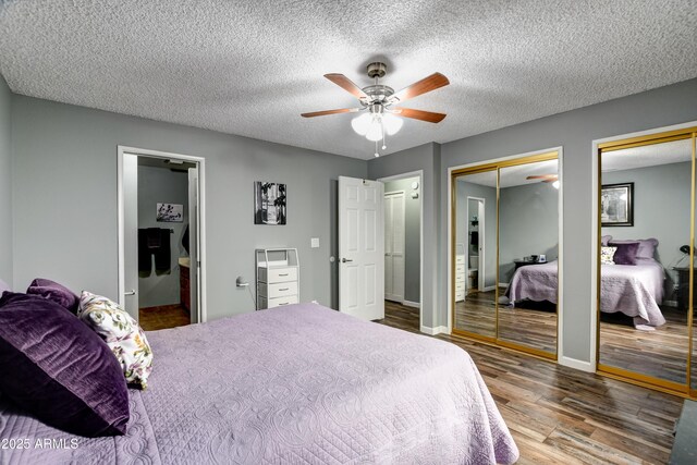 419 Apache Plume Trl, Prescott, AZ 86301 - bedroom featuring wood finished floors, baseboards, two closets, and a textured ceiling