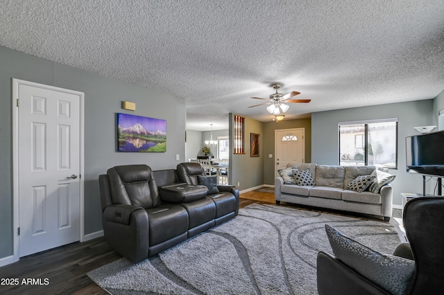 419 Apache Plume Trl, Prescott, AZ 86301 - living area with dark wood finished floors, ceiling fan with notable chandelier, baseboards, and a textured ceiling
