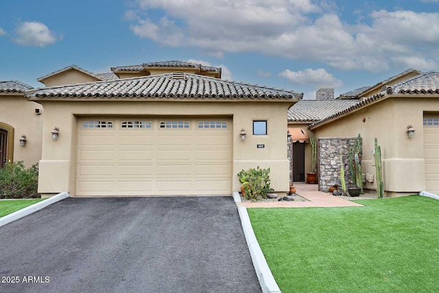 view of front of home with a garage and a front yard