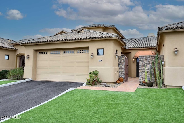 view of front of property with a garage and a front yard