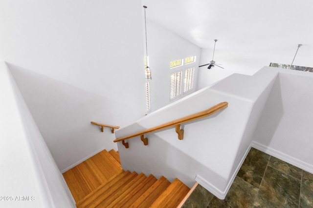 2109 W Wildhorse Dr, Chandler, AZ 85286 - stairs with lofted ceiling, a ceiling fan, and stone finish flooring