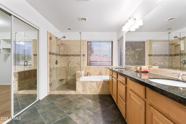 2109 W Wildhorse Dr, Chandler, AZ 85286 - full bathroom featuring a garden tub, double vanity, a stall shower, and tile patterned flooring