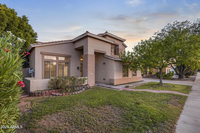 2109 W Wildhorse Dr, Chandler, AZ 85286 - view of front facade with stucco siding, a lawn, and a tile roof