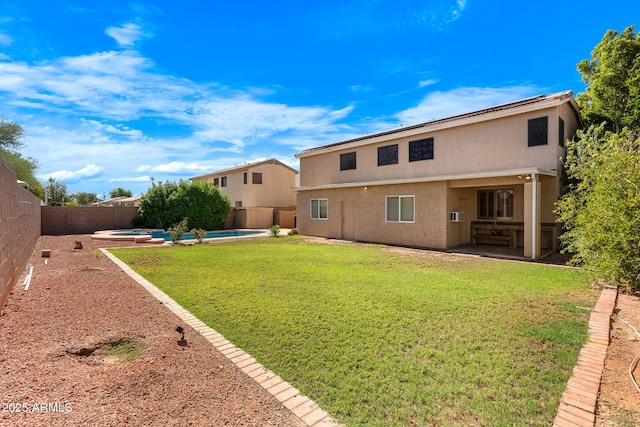 2109 W Wildhorse Dr, Chandler, AZ 85286 - back of house featuring a fenced backyard, a patio, stucco siding, and a pool with connected hot tub