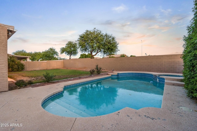 2109 W Wildhorse Dr, Chandler, AZ 85286 - pool at dusk featuring a fenced backyard and a pool with connected hot tub