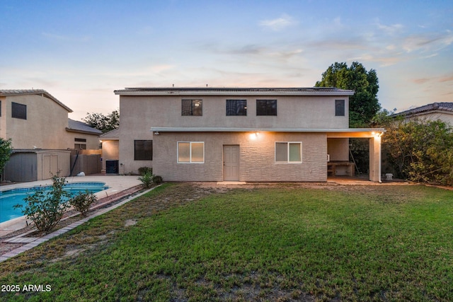 2109 W Wildhorse Dr, Chandler, AZ 85286 - back of property at dusk featuring a patio area and stucco siding
