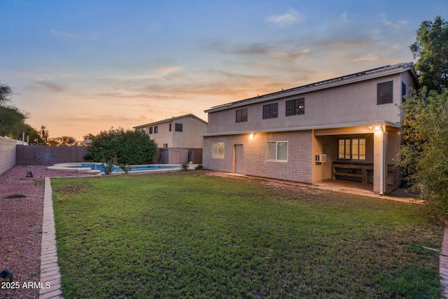 2109 W Wildhorse Dr, Chandler, AZ 85286 - back of property at dusk with a fenced backyard and stucco siding