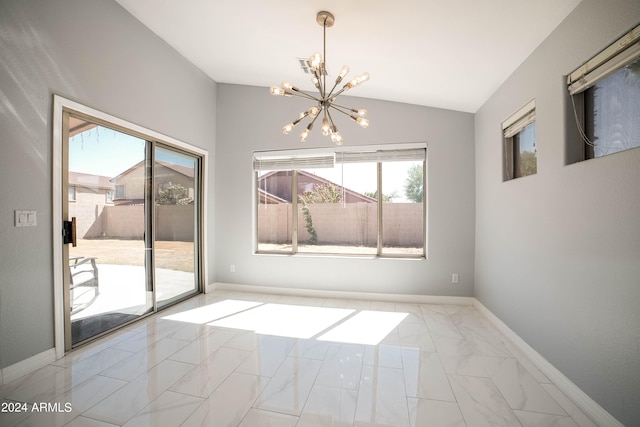 unfurnished dining area with an inviting chandelier and lofted ceiling