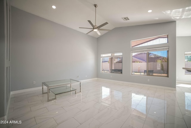 spare room featuring high vaulted ceiling, ceiling fan, and a wealth of natural light