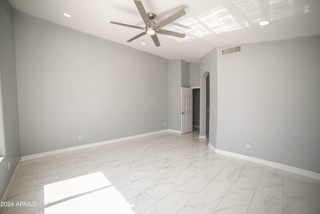 unfurnished room with ceiling fan