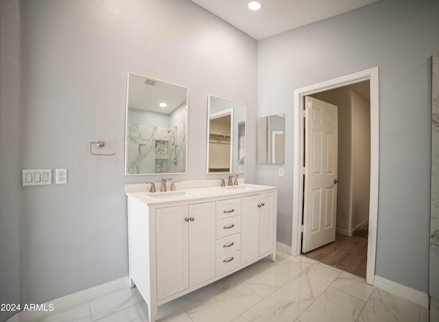 bathroom with vanity and an enclosed shower