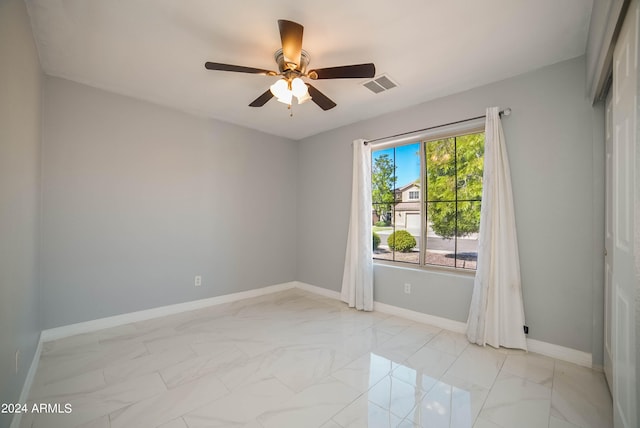 empty room featuring ceiling fan