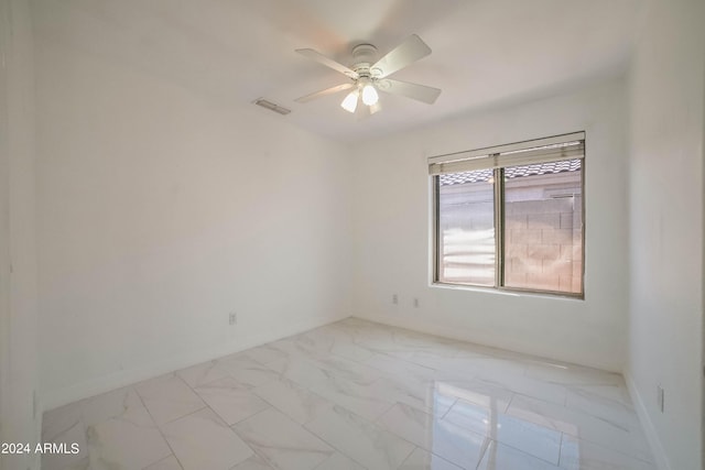 spare room featuring ceiling fan