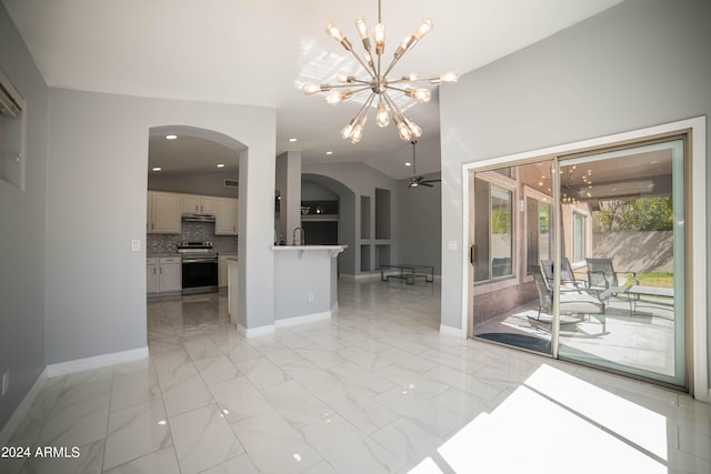 interior space featuring ceiling fan and lofted ceiling