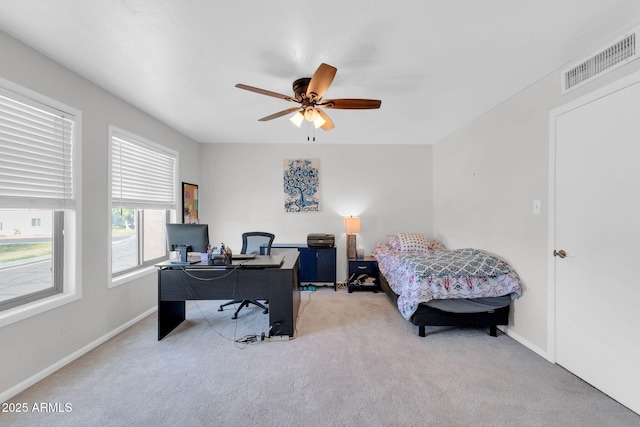 bedroom featuring visible vents, carpet floors, baseboards, and ceiling fan