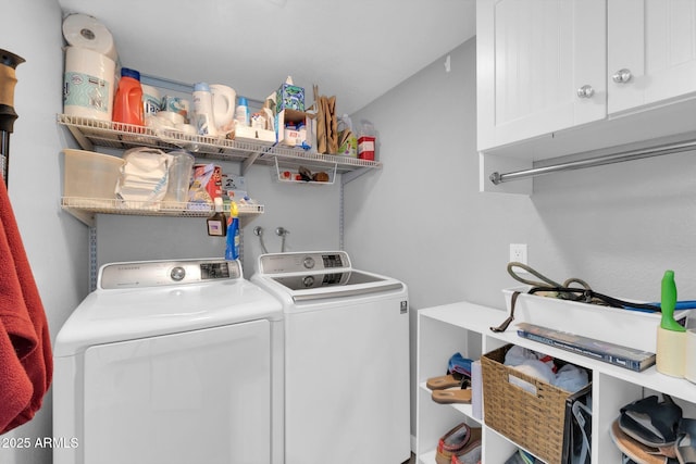 laundry room with cabinet space and washing machine and dryer