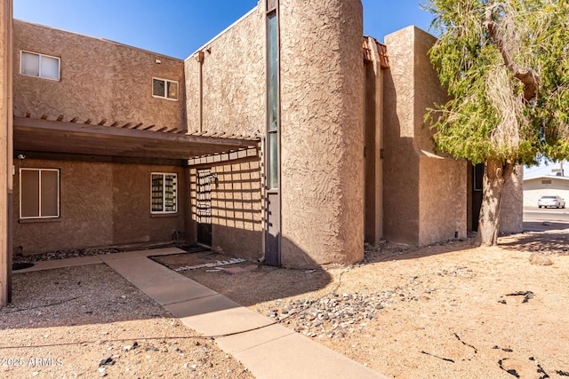 exterior space featuring stucco siding