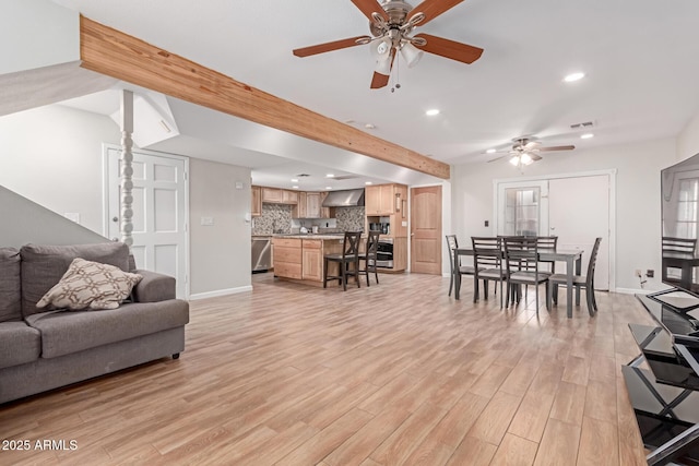 living area with light wood-style floors, baseboards, visible vents, and recessed lighting