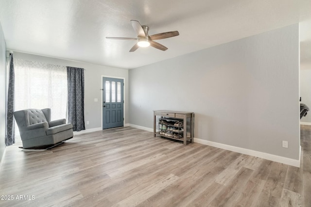 unfurnished room featuring ceiling fan and light hardwood / wood-style flooring