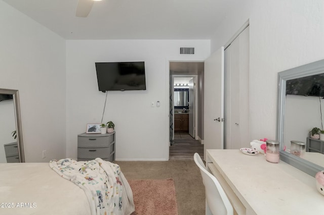 bedroom with carpet floors and a closet