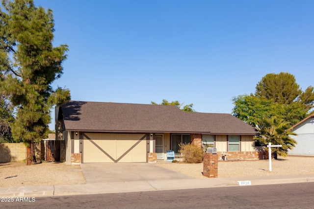 ranch-style house featuring a garage