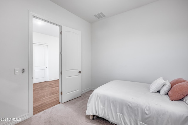 bedroom featuring light wood-type flooring