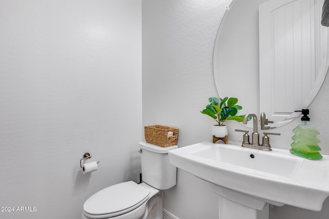 bathroom with toilet and sink