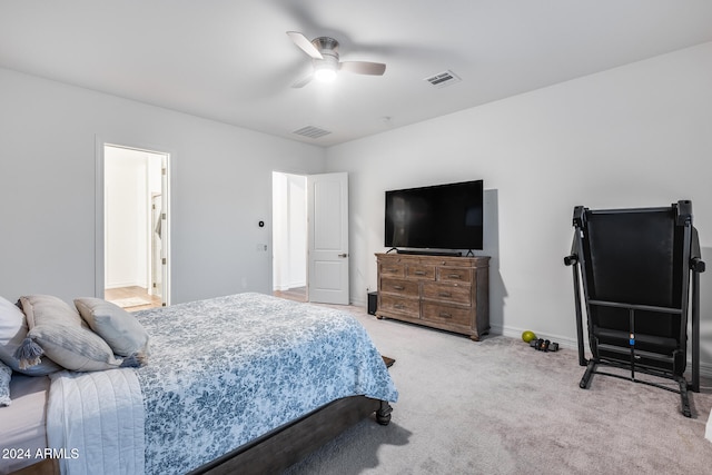 bedroom with carpet flooring, ceiling fan, and ensuite bathroom