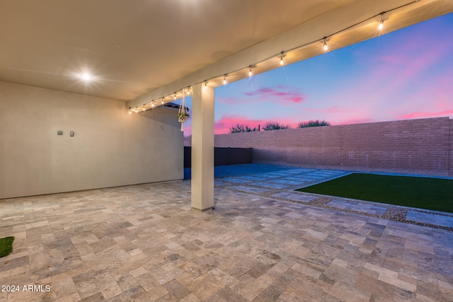 view of patio terrace at dusk