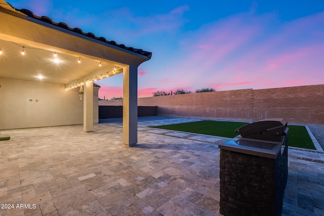 view of patio terrace at dusk