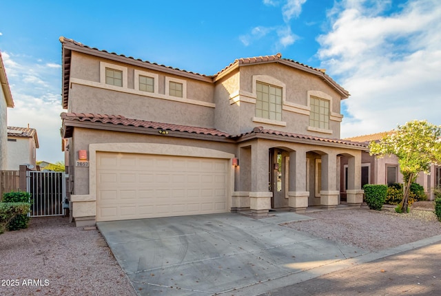 2652 E Riviera Dr, Chandler, AZ 85249 - mediterranean / spanish-style home featuring an attached garage, driveway, and stucco siding