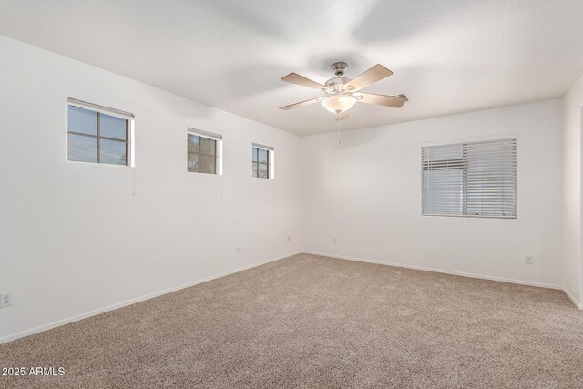 2652 E Riviera Dr, Chandler, AZ 85249 - empty room with light carpet, ceiling fan, and baseboards