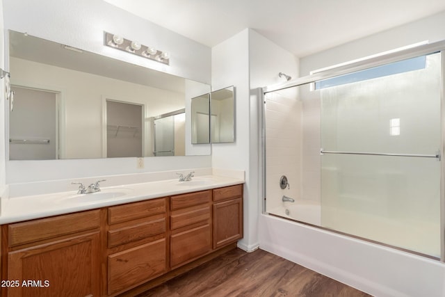 2652 E Riviera Dr, Chandler, AZ 85249 - full bathroom with double vanity, wood finished floors, and shower / bath combination with glass door